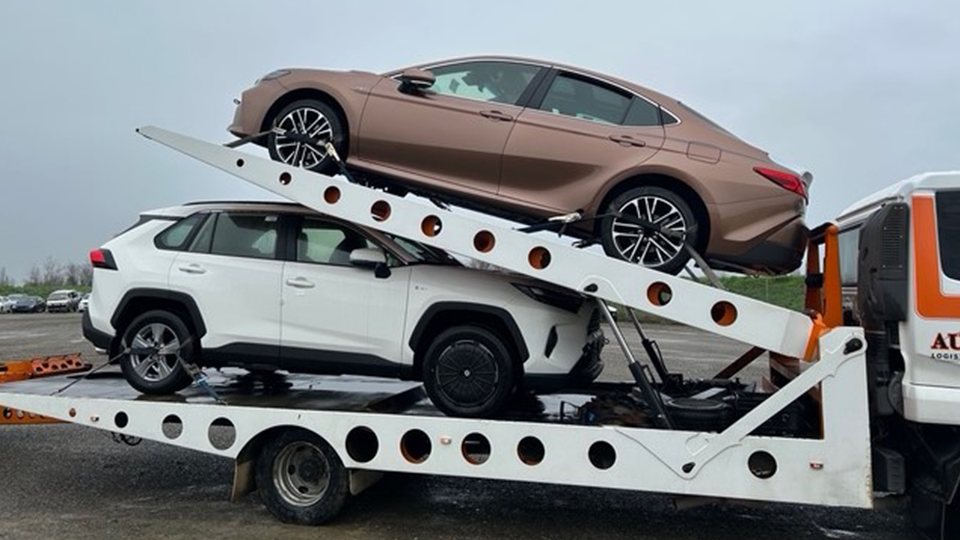 Toyota vehicles on a transporter truck